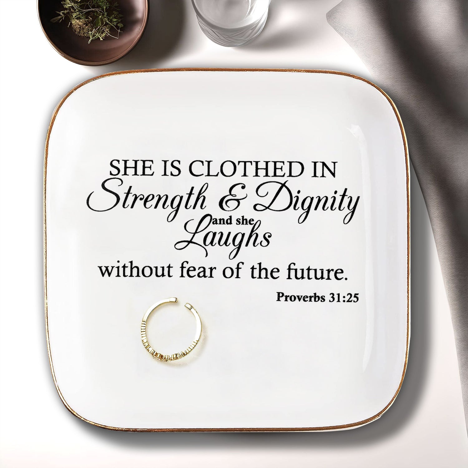 She is clothed in Strength Inspirational Gifts for Women Ceramic Ring Dish Birthday Gifts for Women Unique, Best Friends Gifts For Women Her Mom Sister Coworker